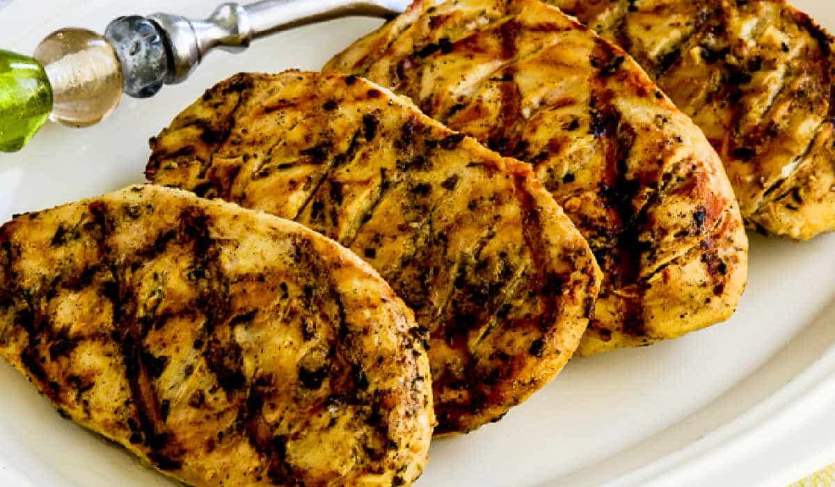 Square image of Grilled Tarragon Mustard Chicken shown on serving plater.