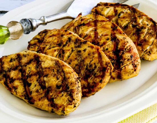 Square image of Grilled Tarragon Mustard Chicken shown on serving plater.