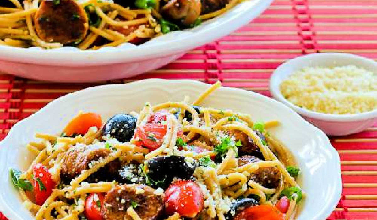 Spaghetti Pasta Salad in two serving bowls on red placemat.