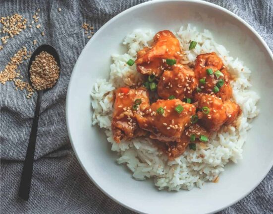 Overhead image of Sweet Chili Chicken on awhite plate with rice