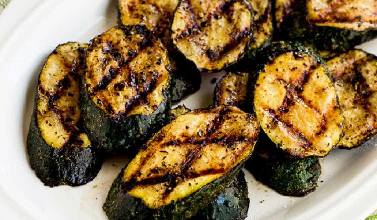 Square image for How to Grill Zucchini showing zucchini on serving plate.