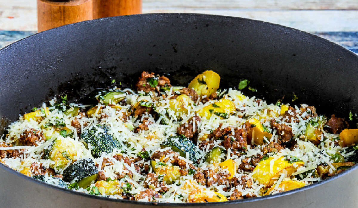 Square image for Italian Sausage and Zucchini Skillet meal shown in skillet.
