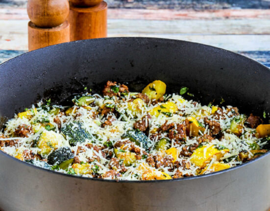 Square image for Italian Sausage and Zucchini Skillet meal shown in skillet.