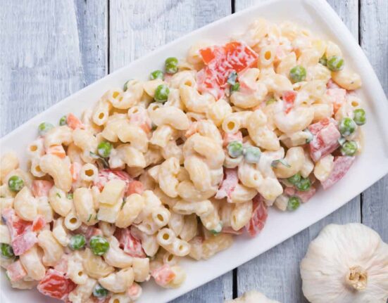 Overhead image of Macaroni Salad on a white platter