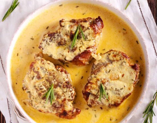 Overhead image of Creamy Pork Chops in a white bowl