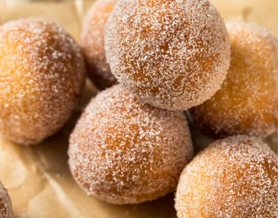 Close up image of Air Fryer Donut Holes on a neutral background