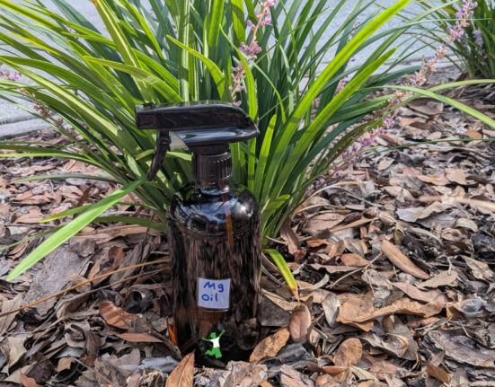 homemade magnesium oil in a glass spray bottle