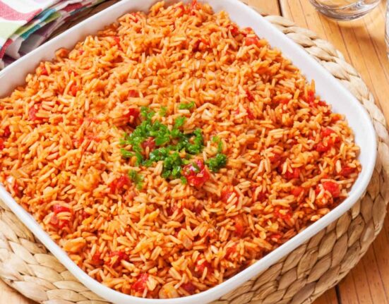 Overhead image of Spanish Rice in a square white container