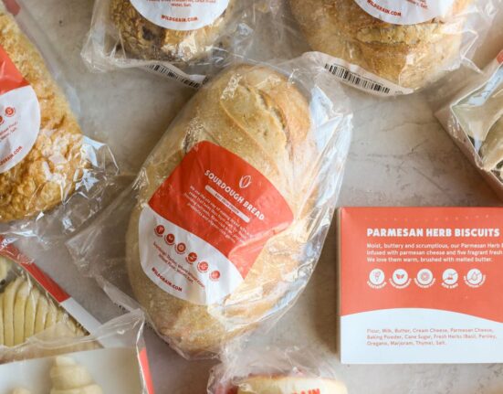 Overhead view of sourdough bread loaves and products.