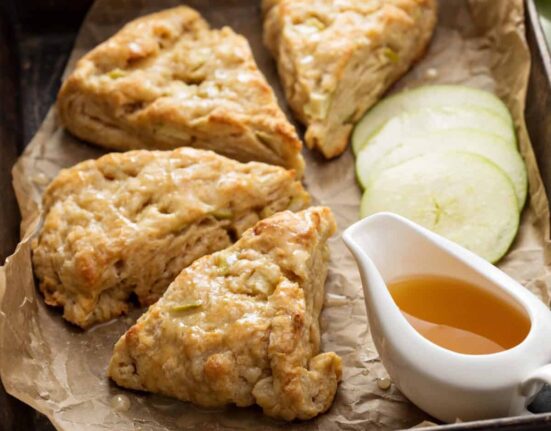 Apple Scones on parchment apper with caramel sauce