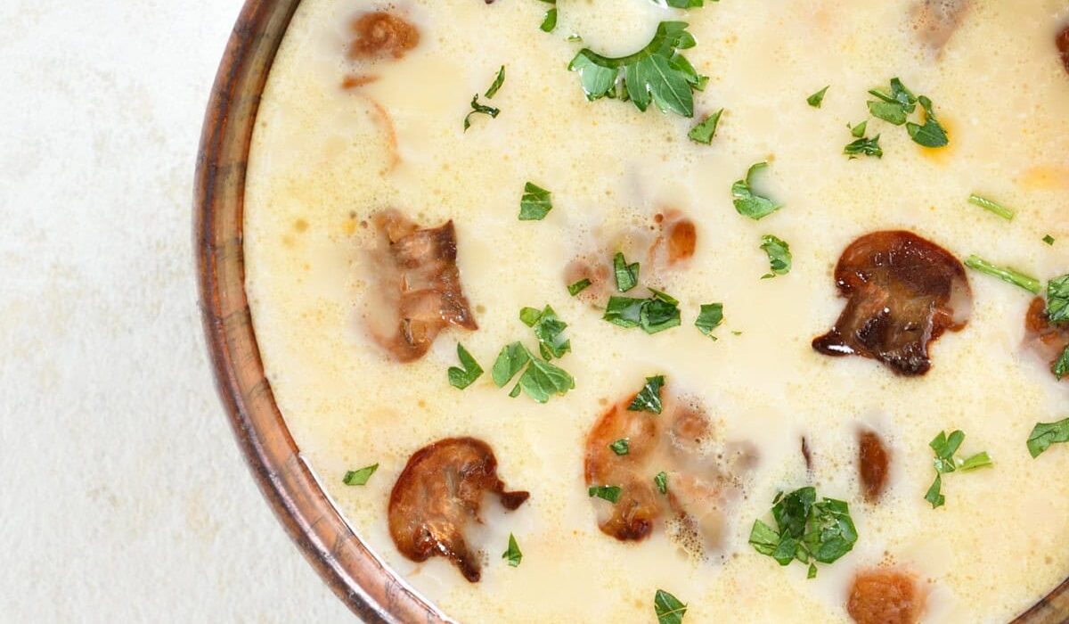 Close up image of Creamy Mushroom Soup in a brown bowl