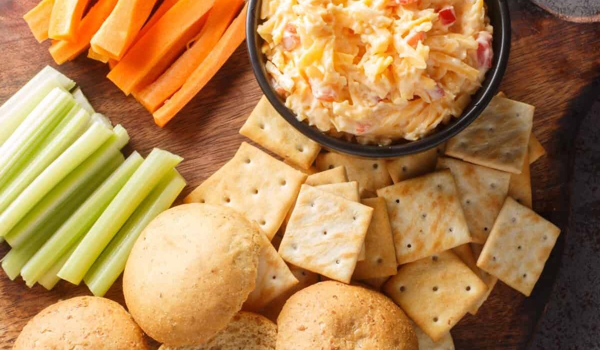 Overhead image of Pimento Cheese Dip on a board with dippers