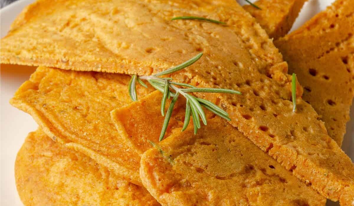 Close up image of socca with herbs