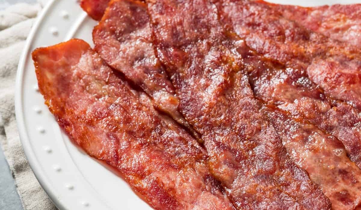 Overhead image of Air Fryer Turkey Bacon on a white plate