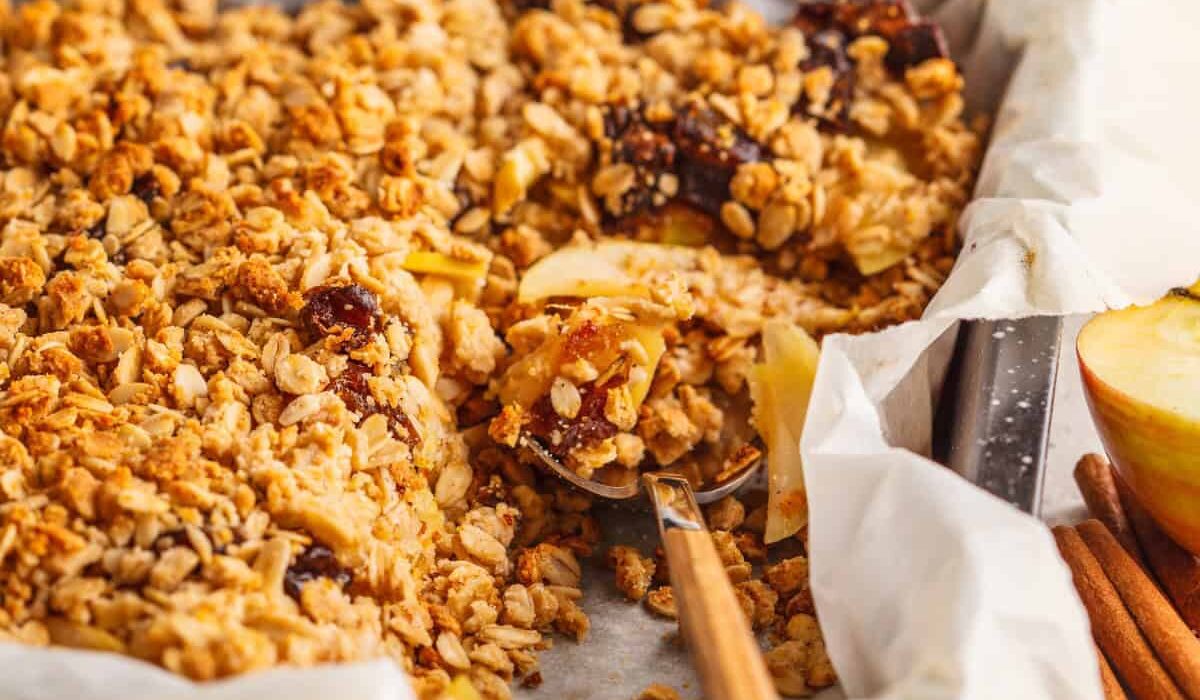 Baked Apple Cinnamon Oatmeal with a serving spoon