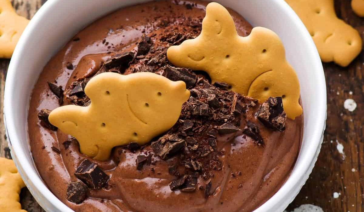 Overhead image of Edible Brownie Batter in a white bowl with cookies