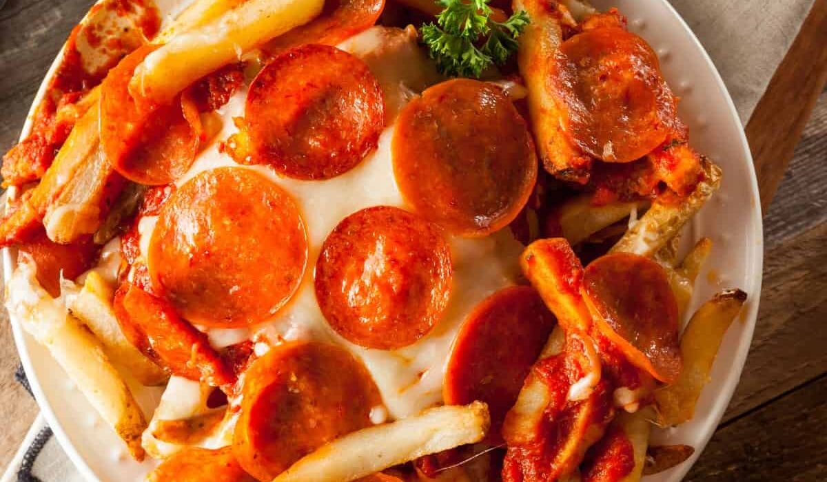 Overhead image of Air Fryer Pizza Fries on a white plate