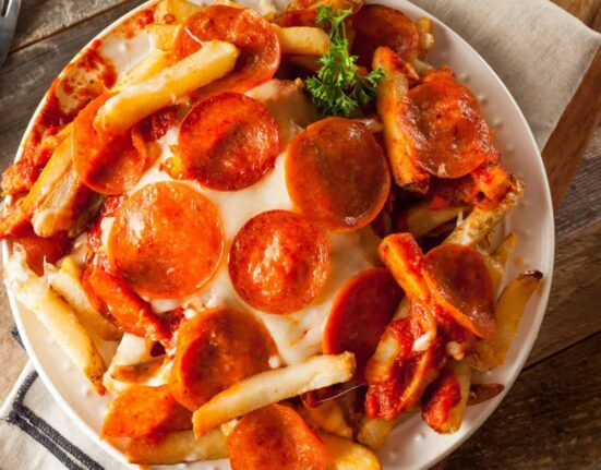 Overhead image of Air Fryer Pizza Fries on a white plate
