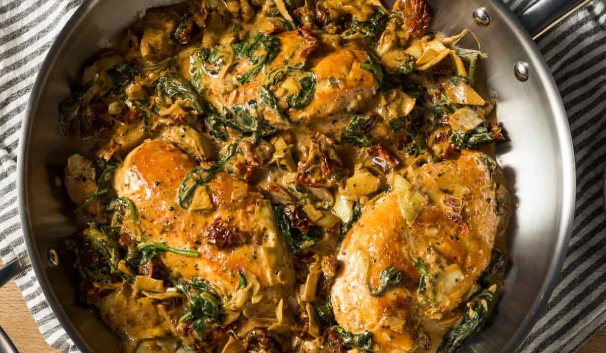 Overhead image of Spinach Artichoke Chicken in a pan