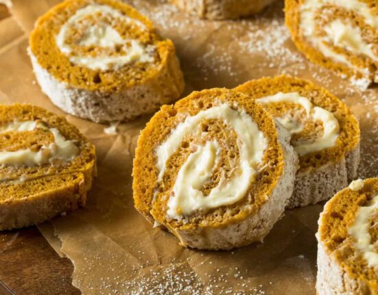 Close up image of Pumpkin Roll Slices on parchment paper