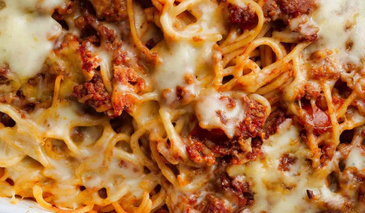 Close up image of baked spaghetti in a baking dish