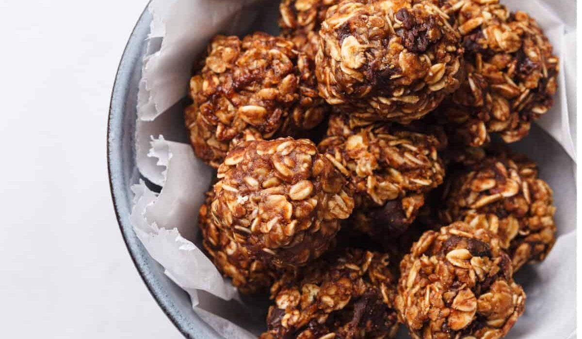 Overhead image of chocolate balls in a bowl with parchment paper