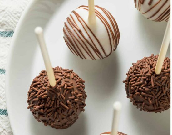 Overhead image of cake pops on a white plate