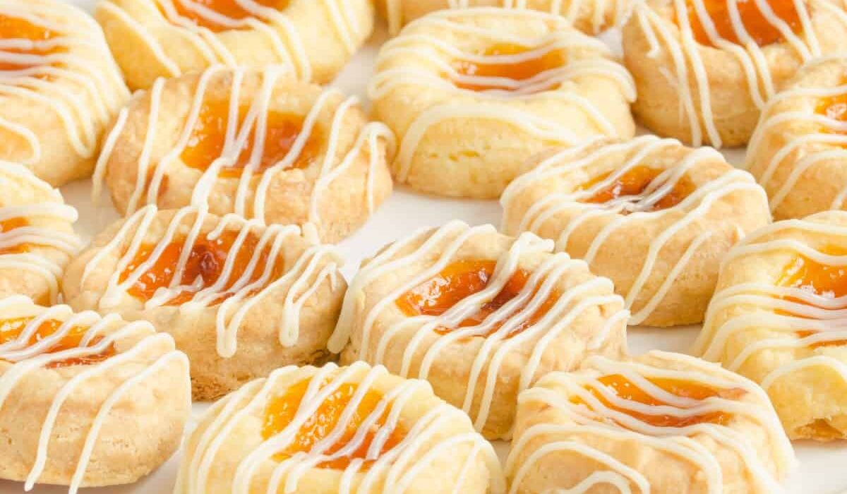 Kolaches on a white plate on a light surface