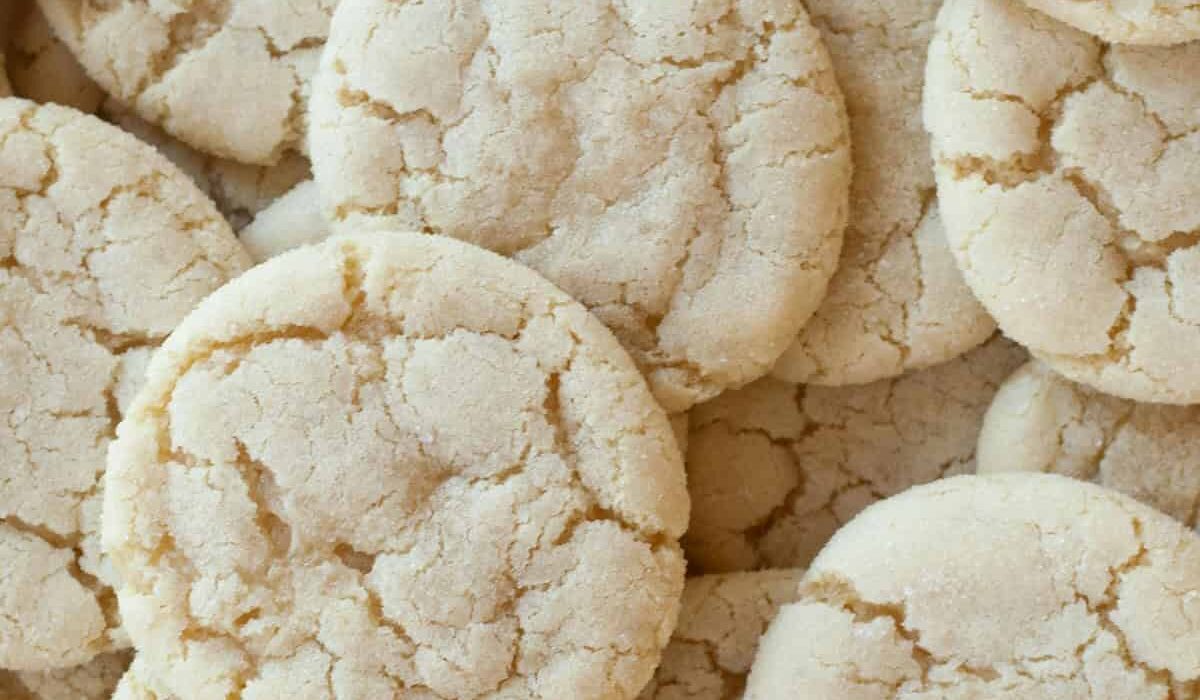 A close up image of a bunch of soft sugar cookies stacked on top of eachother