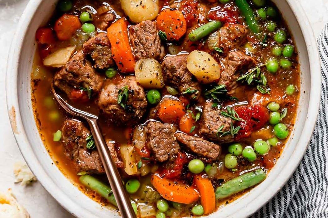 Overhead view bowl with serving of instant pot vegetable beef soup