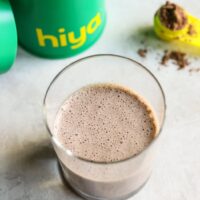 Overhead view of a glass of hiya drink mix showing the frothy chocolate top.