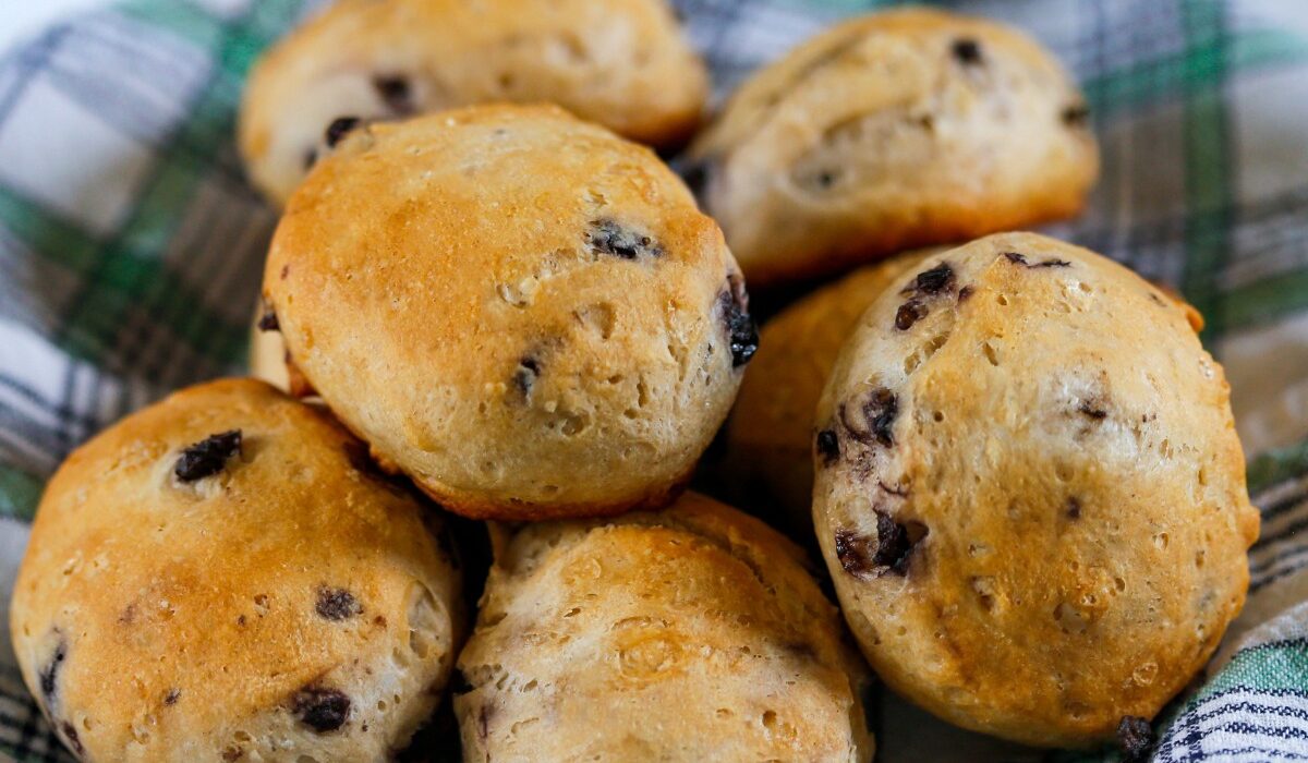 Blueberry Biscuits on a plaid cloth stacked in a pile