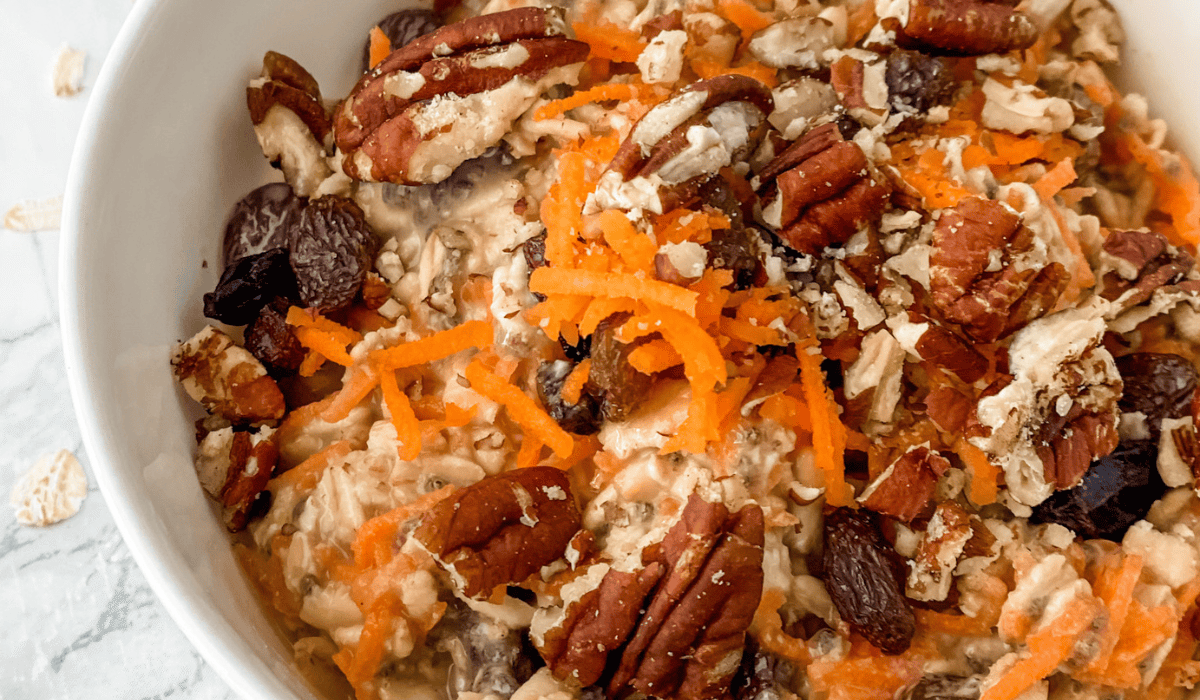 close-up view of carrot cake overnight oats in a white bowl
