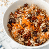 close-up view of carrot cake overnight oats in a white bowl