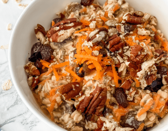 close-up view of carrot cake overnight oats in a white bowl