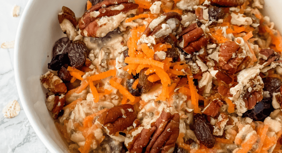 close-up view of carrot cake overnight oats in a white bowl