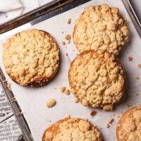 Baked Vegan Streuselbrötchen (crumble rolls) on a baking tray.