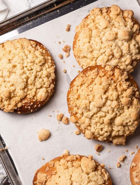 Baked Vegan Streuselbrötchen (crumble rolls) on a baking tray.