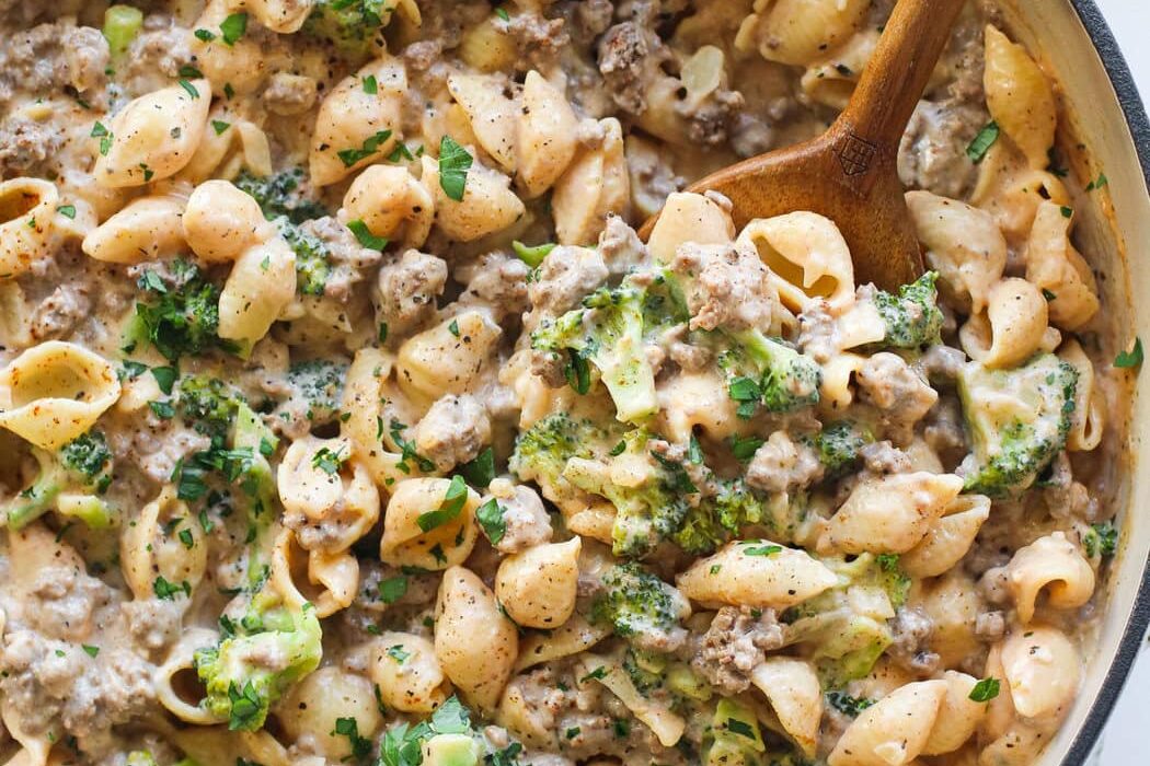 Overhead view of a skillet of fresh Homemade Hamburger Helper topped with fresh herbs.