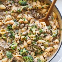 Overhead view of a skillet of fresh Homemade Hamburger Helper topped with fresh herbs.
