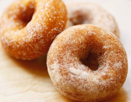 Keto Donuts on a neutral wooden surface