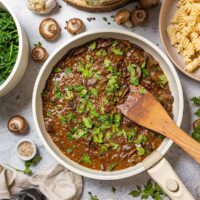 Lentil and Mushroom Stroganoff in a skillet on the table.