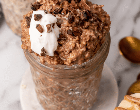 Healthy chocolate overnight oats with yogurt, protein, and fiber in a glass jar. Perfect for quick,.