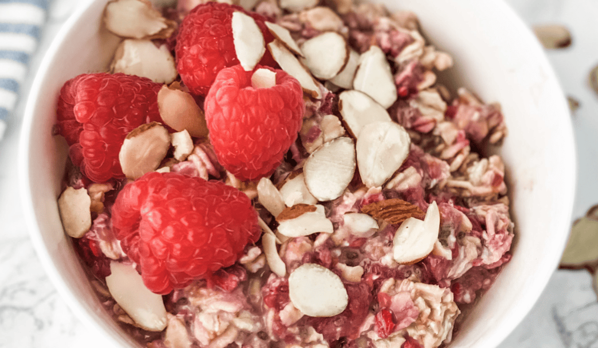 raspberry overnight oats in a white bowl