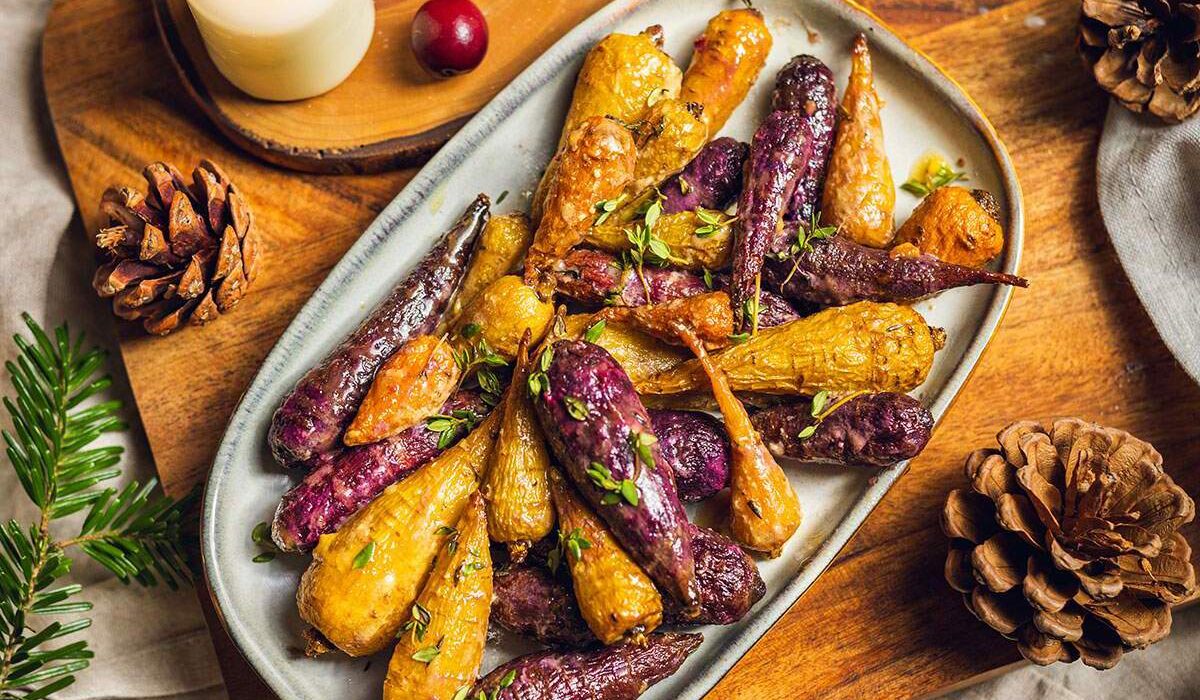 Roasted rainbow carrots on a serving tray.