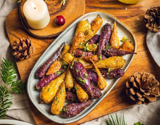 Roasted rainbow carrots on a serving tray.