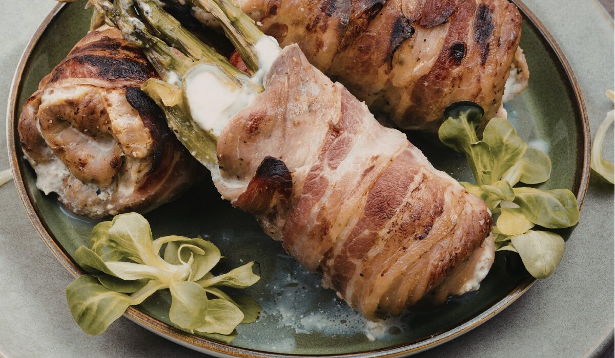 asaparagus stuffed chicken thighs on a plate