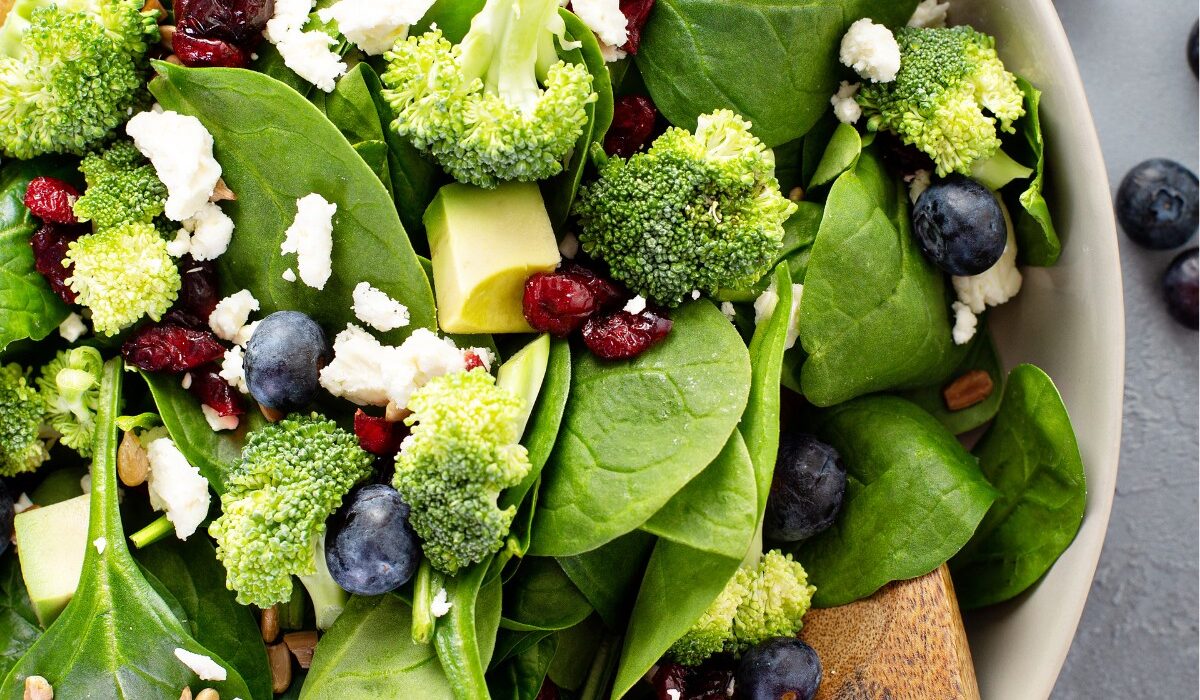 Close up image of blueberry salad with spinach