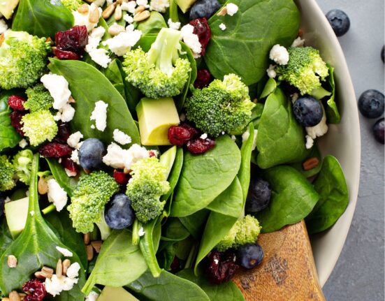 Close up image of blueberry salad with spinach