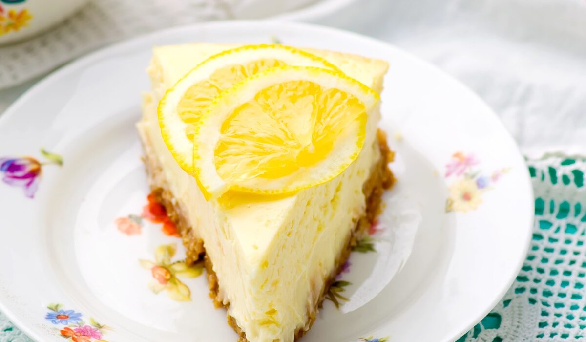 Close up image of lemon cheesecake on a decorative plate